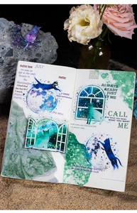 Detailed view of cosmic cat PET stickers with glitter effect applied in a scrapbook