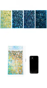 Close-up of butterfly stickers with gold foil and iridescent shell finish effects