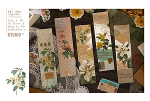 Detailed view of vintage floral scrapbooking strips with elegant French typography