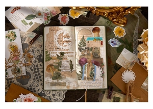 Close-up of vintage aesthetic stickers with botanical motifs on dark wood background
