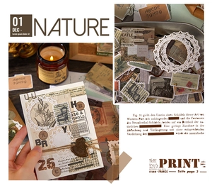 Detail of vintage scrapbooking kit showing floral stickers and lace paper textures