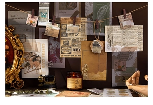 Macro shot of vintage botanical journal stickers with butterflies and floral motifs