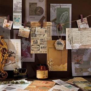 Vintage scrapbooking kit with botanical stickers, retro papers, and a brown scented candle