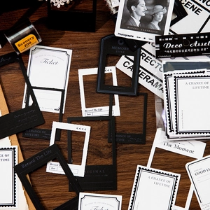 Vintage scrapbooking material kit with retro film frames and ticket stickers on wood