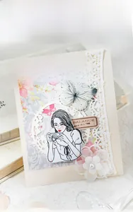 Detail of floral lace paper and butterfly stickers for vintage journaling decoration