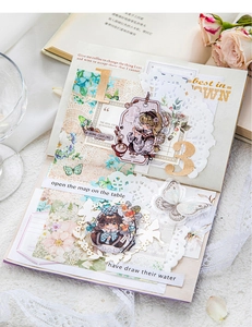 Collage of floral lace scrapbooking paper with butterfly stickers and vintage labels