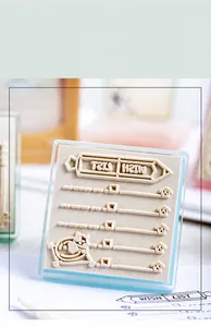 Detail of clear cat-themed Wish List stamp with acrylic base for scrapbooking journaling