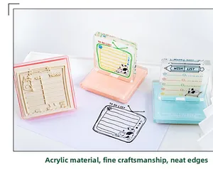Detailed close-up of acrylic cat-themed stamps with to-do lists and clear designs