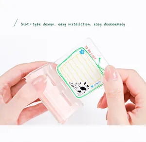 Hands holding a pink transparent acrylic card holder with a cute cat To Do List card