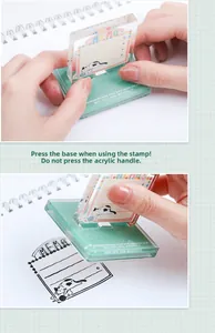 Detailed view of cat-themed transparent memo stamp showing acrylic base and clear ink print