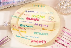 Détail d'autocollants PET transparents colorés avec phrases anglaises pour journal DIY
