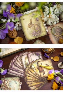 Detailed close-up of vintage flower and rabbit scrapbooking paper with torn edges