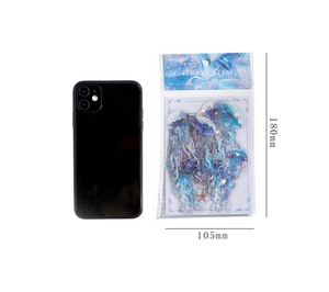 Adesivi medusa oro laser accanto a uno smartphone come riferimento di misura, 180x105mm