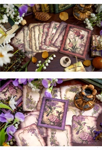 Detail showing vintage floral stickers with hummingbird and tulip designs for journaling