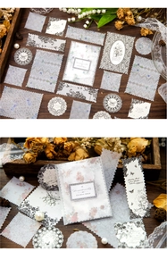 Détails d'autocollants de dentelle florale vintage et papier déco sur fond bois foncé