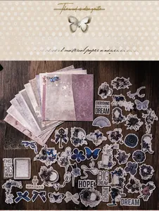 Close-up of vintage scrapbook material pack with floral stickers and butterfly paper