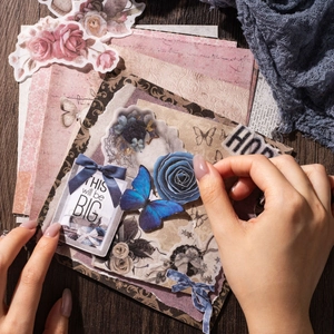60 sheets of vintage journal paper with floral, butterfly and label motifs on wood