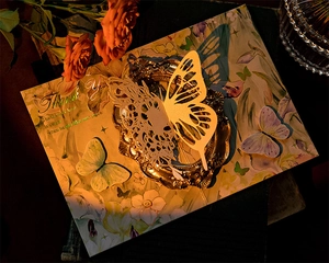 Detailed view of hollow paper carving butterfly 3D thank you card with gold foil accent