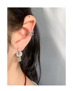 Detail of silver S925 earrings with white jade circle and Fu character pendant