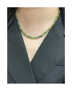 Close-up of S925 silver bamboo-style necklace with natural green olive jade beads