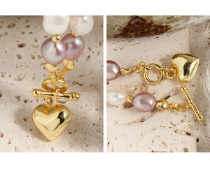 Detail view of S925 sterling silver heart pendant and pink baroque pearls with OT buckle