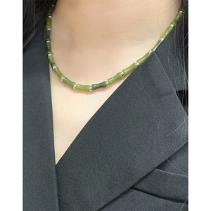 Minimalist S925 silver necklace with green natural bamboo-shaped jade beads on a model