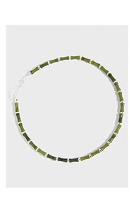 Detailed top view of a S925 sterling silver bamboo necklace with green jade-like beads