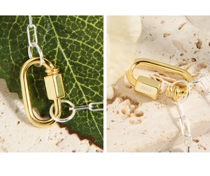 Macro shot of S925 sterling silver stamp on golden D-clasp necklace components