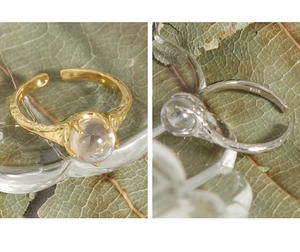 Detailed view of S925 sterling silver stamp and claw-set zircon on textured ring