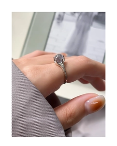 Macro detail of S925 sterling silver ring featuring an irregular claw-set zircon gemstone