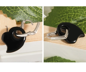 Detailed view of S925 sterling silver heart earrings with black onyx pendants and hallmarking