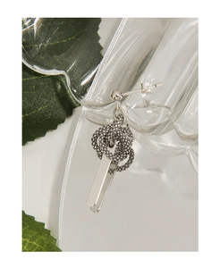 Close-up of S925 silver stud earring with snake pattern ring and polished metal plate