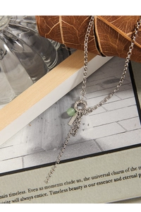Detailed close-up of S925 sterling silver chain with green aventurine and metal tag