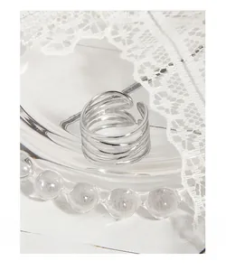 Close-up of S925 sterling silver stamp on minimalist multi-layer interlaced ring