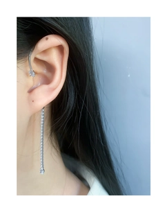 Close-up of S925 sterling silver tassel earring with sparkling zircon on model's ear