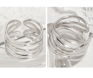 Detailed close-up of S925 sterling silver multilayered wrap ring with engraved hallmark