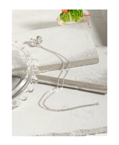 Close-up of S925 sterling silver ear cuff featuring a minimalist tassel chain design