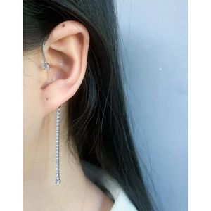 Minimalist S925 sterling silver ear cuff featuring sparkling zircon tassel drop on model