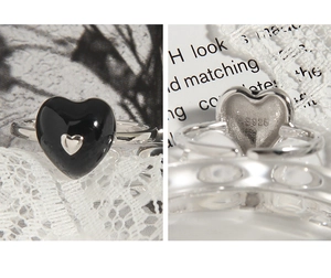 Detail of S925 sterling silver heart ring showing the hallmark and black enamel heart inlay