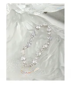 Macro shot of S925 silver bracelet with sparkling round and pear-cut cubic zirconia