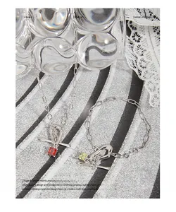 Detail of S925 silver OT buckle necklace and bracelet set with red and yellow zircon stones
