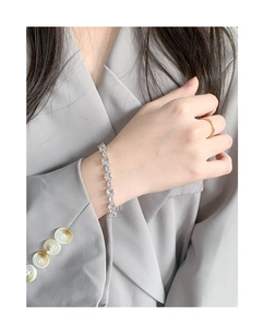 Close-up of S925 sterling silver bracelet featuring square-cut sparkling cubic zirconia