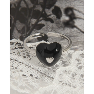Adjustable S925 silver ring featuring a black heart charm on a white lace surface