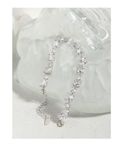 Detailed view of S925 sterling silver bracelet with multi-shape cubic zirconia and claws