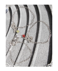 Detailed view of silver S925 OT buckle bracelets with red, yellow, and clear zircons