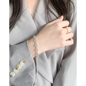 Elegant S925 sterling silver bracelet with sparkling zircon stones on a female wrist