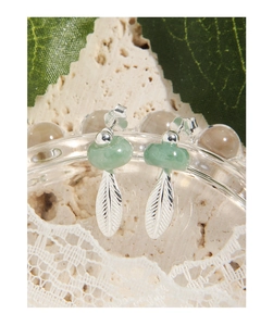 Macro view of S925 sterling silver hallmark on leaf drop earrings with green jade beads