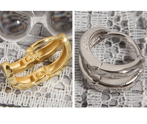 Macro detail of S925 sterling silver earrings with hammered texture and hallmark