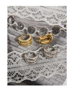 Detailed macro view of S925 sterling silver minimalist double-layer hoop earrings in gold and silver