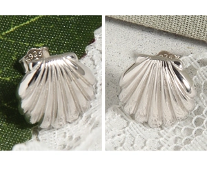Macro view of S925 sterling silver shell earrings with detailed fan texture